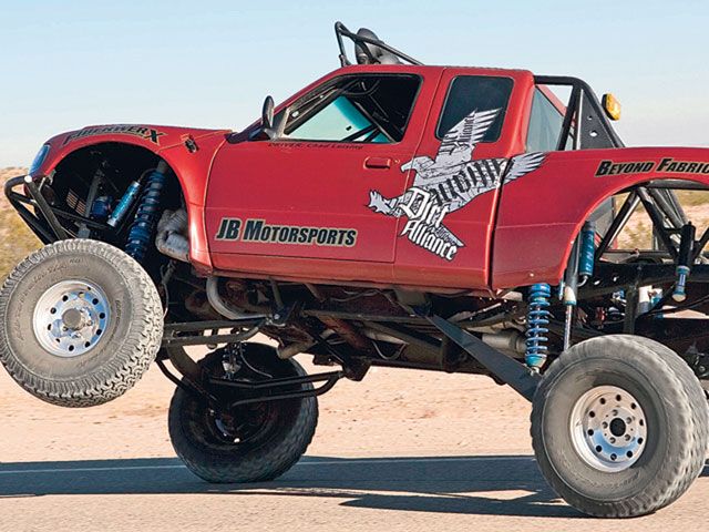 Red Prerunner Truck on three wheels