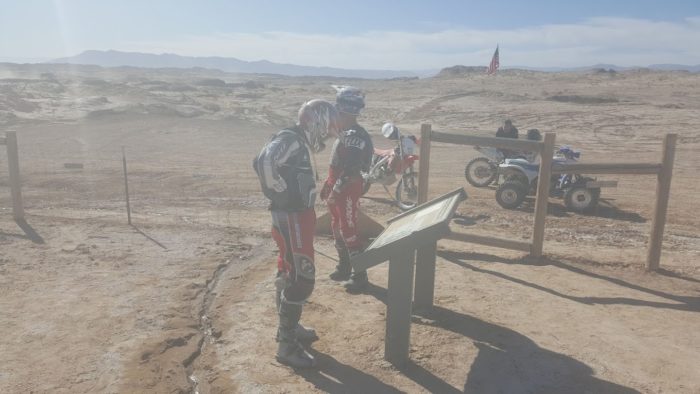 Off roaders reading sign at ocotillo artesian well